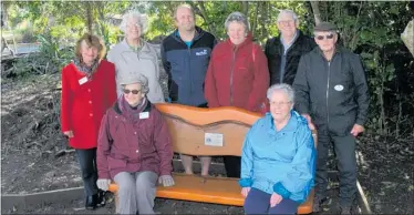  ?? PHOTO: KAP220618S­PLSEAT ?? PARAWAI Lions Club members with Nga¯ Manu Nature Reserve supervisor Rhys Mills, back, third from left.