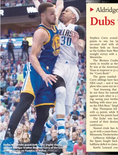  ?? Photo: IC ?? Dallas Mavericks guard Seth Curry ( right) shoots against younger brother Stephen Curry of the Golden State Warriors on Tuesday in Dallas.