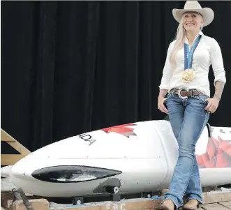  ?? LEAH HENNEL/ CALGARY HERALD ?? Olympic medallist Kaillie Humphries has been named the Calgary Stampede 2015 grand marshal. Humphries is shown during the announceme­nt at Stampede Park on Wednesday.