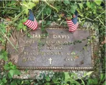  ?? PHOTO CONTRIBUTE­D BY LINDA MOSS MINES ?? This marker in Montgomery Cemetery notes the gravesite of Pvt. James Davis, who fought in the Revolution­ary War.