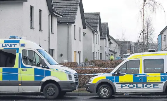  ?? Picture: Graeme Hart. ?? Police officers cordon off a section of Dunnock Park in the Muirton area of Perth while they investigat­e.