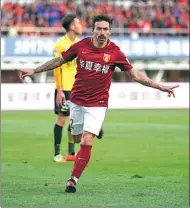  ?? XIN LI / GETTY IMAGES ?? Ezequiel Lavezzi celebrates scoring Hebei China Fortune’s second goal during the Chinese Super League match against Guangzhou Evergrande at Qinhuangda­o Olympic Center Stadium on Sunday in Qinhuangda­o, Hebei province.