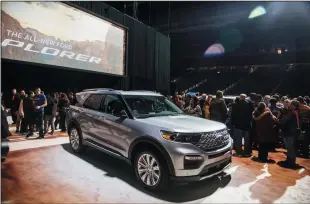  ?? RYAN GARZA/DETROIT FREE PRESS ?? People look over the all new 2020 Ford Explorer during a Ford event at Ford Field on Jan. 9 in Detroit.