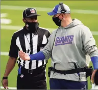  ?? Ashley Landis / Associated Press ?? Giants coach Joe Judge talks to a referee during Sunday’s loss to the Rams in Inglewood, Calif.