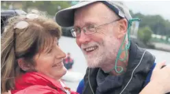  ??  ?? Marie Crothers welcomes her husband Garry home after his solo journey