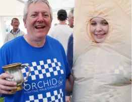  ??  ?? Ian Wisdom (left) with a volunteer in fancy dress at last year’s Twyford Beer Festival. This year’s event takes place tomorrow and Saturday