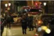  ?? THIBAULT CAMUS - THE ASSOCIATED PRESS ?? Police officers secure the area after a knife attack in central Paris, Saturday May 12, 2018. The Paris police said the attacker was subdued by officers during the stabbing attack in the 2nd arrondisse­ment or district of the French capital Saturday.