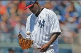  ?? KATHY WILLENS — THE ASSOCIATED PRESS ?? New York Yankees starting pitcher CC Sabathia tosses the ball up after allowing a tworun single to Toronto Blue Jays’ Kendrys Morales during the third inning of a baseball game in New York, Tuesday. Yankees manager Joe Girardi removed Sabathia after he...