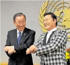 ?? ?? Psy (right) performs a dance step from his song “Gangnam Style” with former United Nations Secretary General Ban KiMoon
