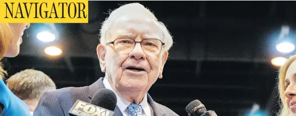  ?? NATI HARNIK/THE ASSOCIATED PRESS ?? Warren Buffett, Chairman and CEO of Berkshire Hathaway, speaks to reporters Saturday during the annual shareholde­rs meeting in Omaha, Neb.