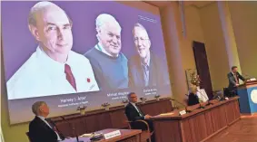  ?? CLAUDIO BRESCIANI/AP ?? Thomas Perlmann, far right, secretary of the Nobel Assembly announces the 2020 Nobel laureates in Physiology or Medicine at the Karolinska Institute in Stockholm, Sweden, on Monday.