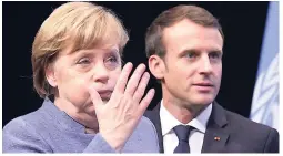  ??  ?? German Chancellor Angela Merkel and French President Emmanuel Macron.