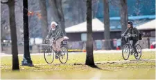  ?? MATHEW MCCARTHY METROLAND FILE PHOTO ?? Cyclists ride though a sunny Victoria Park in Kitchener in February.