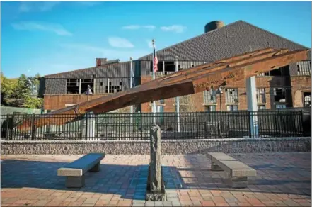  ?? SUBMITTED PHOTO – SAM RADZIVILIU­K/NISHM ?? Shown is the Steelworke­rs Memorial with the 120” Mill in the background. The memorial features one of the 50-ton steel tridents from the World Trade Center.