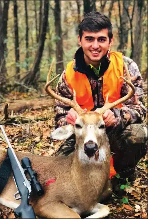  ?? Photo submitted by Brad Kohler ?? Guilherme Ribeiro, 17, an exchange student from Itajai, Brazil, was initiated into Arkansas’ hunting culture Nov. 11 when he killed this buck while hunting with his exchange host, Brad Kohler.