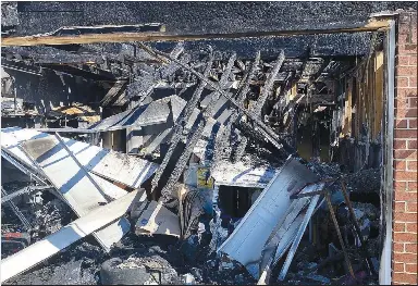  ?? Special to the Eagle Observer/DANIEL BEREZNICKI ?? Fire destroyed the garage which was connected to the house.