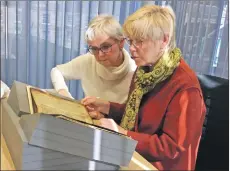  ??  ?? Breege Smyth and Marlyn Turbitt looking at the 12th-century Glenmasan manuscript in the National Library of Scotland in Edinburgh.