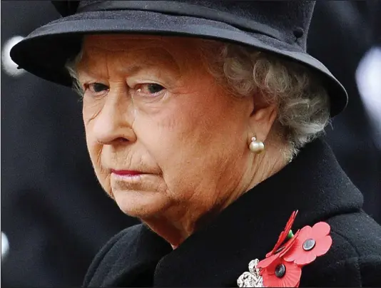  ??  ?? Duty: In a break with tradition, the Queen was applauded at the end of the Service of Remembranc­e at Cenotaph yesterday