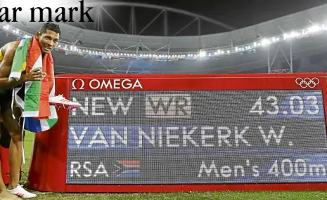  ?? AP ?? SOUTHAfric­a’sWayde van Niekerk strikes a pose after shattering Michael Johnson’s 17-year-old record in the men’s 400 meters.