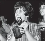  ?? MCT ?? A fan is overcome with excitement during the Beatles’ concert in 1964. Noise levels apparently reached epic levels, as screaming fans often drowned out the group’s set.