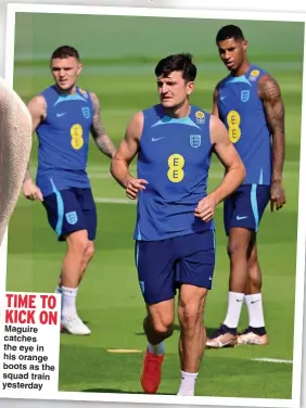  ?? ?? TIME TO KICK ON
Maguire catches the eye in his orange boots as the squad train yesterday