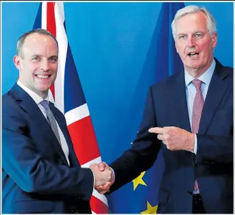  ??  ?? Britain’s secretary of state for exiting the EU Dominic Raab, left, with EU negotiator Michel Barnier