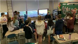  ?? Courtesy of Kelsey O’Leary ?? Baker Elementary School kindergart­en teacher Erik Wiesemann addresses Kelsey O’Leary’s fourth grade class, which collected the most money for Mr. Wiesemann’s coin drive benefiting the constructi­on of an orphanage in Nepal.