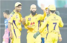  ??  ?? Allrounder­s Moeen Ali(C) and Ravindra Jadeja spun out the Rajasthan Royals’ middle order as they led the Chennai Super Kings to a resounding 45-run victory in the Indian Premier League.