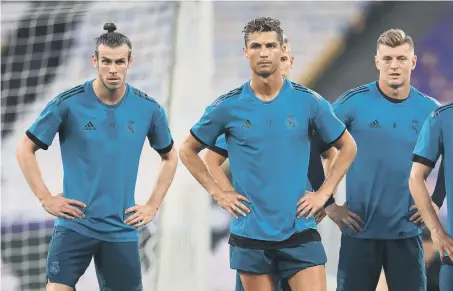  ??  ?? Real Madrid’s Gareth Bale, Cristiano Ronaldo and Toni Kroos during the training session at the NSK Olimpiyski­y Stadium, Kiev.