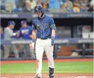  ?? JOHN RAOUX/AP ?? Tampa Bay’s Curtis Mead heads back to the dugout after he struck out looking to end the game as the Rangers beat the Rays 7-1 during Game 2 in their AL wild-card playoff series on Wednesday.