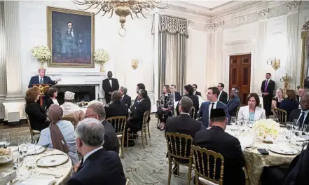  ?? — AP ?? Fortifying ties: Trump addressing guests at the iftar dinner in the State Dining Room of the White House.