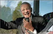  ??  ?? In this 2007 file photo C.T. Vivian uses an intercom with Rev. James Lawson on a bus in Montgomery, Ala., to discuss the experience­s they encountere­d in 1961 as Freedom Riders, a group of college students who defied segregatio­n on interstate buses across the American South.