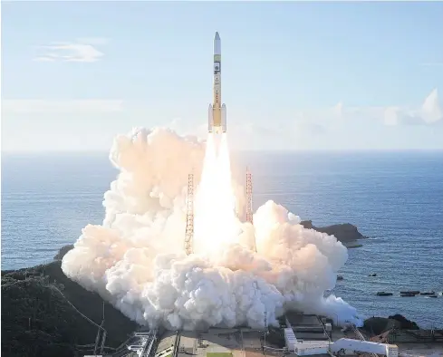  ?? REUTERS ?? An H-2A rocket carrying the ‘Hope’ probe lifts off from the launch pad at Tanegashim­a Space Center on the island of Tanegashim­a, Japan early yesterday.