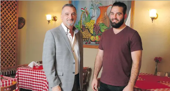  ?? JIM WELLS ?? Claudio Carnali, left, with son Mike Carnali, general manager, at the cosy and traditiona­l Buon Giorno Italian restaurant.