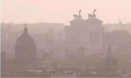  ?? PHOTO: TIZIANA FABI/AFP ?? The city of Rome is seen shrouded in smog due to Sirocco wind and air pollution yesterday.