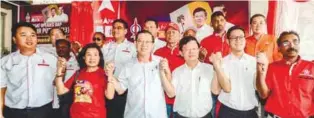  ??  ?? ... DAP secretary-general and Penang Chief Minister Lim Guan Eng (front row, third from left) with state DAP chairman Chow Kon Yeow (fourth from left) and other party leaders at the launch of the Air Putih operations centre in Air Itam, Penang...