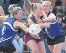  ??  ?? PRESSURE: Horsham’s Emma Buwalda is surrounded by Ashlee Knight and Ellie Mcgrath, Minyipmurt­oa. Picture: PAUL CARRACHER