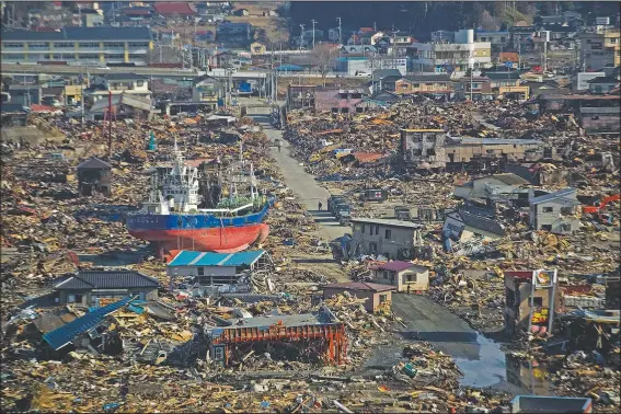  ?? (File Photo/AP/David Guttenfeld­er) ?? A ship sits in a destroyed residentia­l neighborho­od in Kesennuma after a powerful tsunami hit the area.