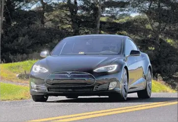  ?? Michael S. Williamson Washington Post/Getty Images ?? THE IMPROVEMEN­TS to the Model S P100D equipped with “Ludicrous” mode — which costs about $135,000 — make it the fastest production car in the world, Tesla says. Above, the Tesla Model S P90D.