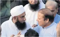  ?? AP ?? Nawaz Sharif talks to Maulana Tariq Jameel at the funeral. —