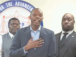  ?? MARK HENLE/THE REPUBLIC ?? State Rep. Reginald Bolding speaks at a press conference at the Arizona Informant in Phoenix on Monday. Looking on is Black Lives Matter representa­tive Reginald Walton (left) and East Valley NAACP President Roy Tatem Jr.