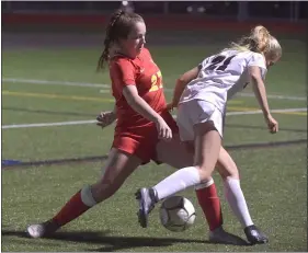  ?? PETE BANNAN — MEDIANEWS GROUP ?? Haverford defender Devin Snell, left, tackles Lower Merion’s Maya Masotti Tuesday in Central League girls soccer action. Lower Merion scored a 1-0victory, though no details on the game were reported to the Daily Times.