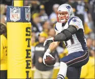  ?? Jared Wickerham / Associated Press ?? Patriots tight end Rob Gronkowski (87) celebrates his touchdown against the Steelers in Pittsburgh on Oct. 23, 2016.