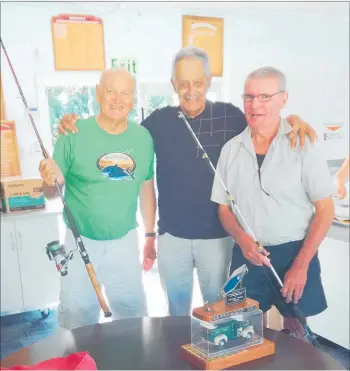  ?? PICTURE / SUPPLIED ?? Frank King presenting John Wyatt and Abi Baer with ‘new’ fishing rods at a recent Doubtless Bay Light Line and Rod Fishing Club prizegivin­g event.