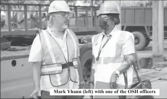 ?? ?? Mark Yhann (left) with one of the OSH officers