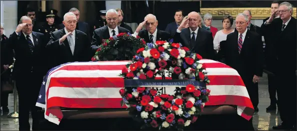  ?? — THE ASSOCIATED PRESS ?? Former secretary of state Colin Powell, third from left, leads former Operation Desert Storm commanders as they pay their last respects to George H.W. Bush as he lies in state at the U.S. Capitol in Washington yesterday.