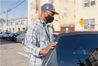  ?? Jessica Christian/The Chronicle ?? John Jones III takes a Lyft to work in Oakland in May. Jones said earlier this year that after being stopped by police several times, he refrains from driving at night or with other Black men.