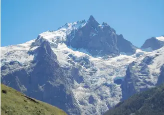  ??  ?? La Meije, elevation 3,982 metres, is the second-highest mountain in the Massif des Ecrins range. It overlooks the village of La Grave, a mountainee­ring centre and ski resort.