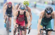  ?? GRAHAM HUGHES/THE CANADIAN PRESS ?? Tyler Mislawchuk of Canada has done well enough at events this year such as the ITU World Triathlon Series race in Montreal in August to be ranked eighth in the world.