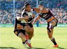  ?? GETTY IMAGES ?? Solomone Kata opened the scoring for the Warriors against the Broncos.